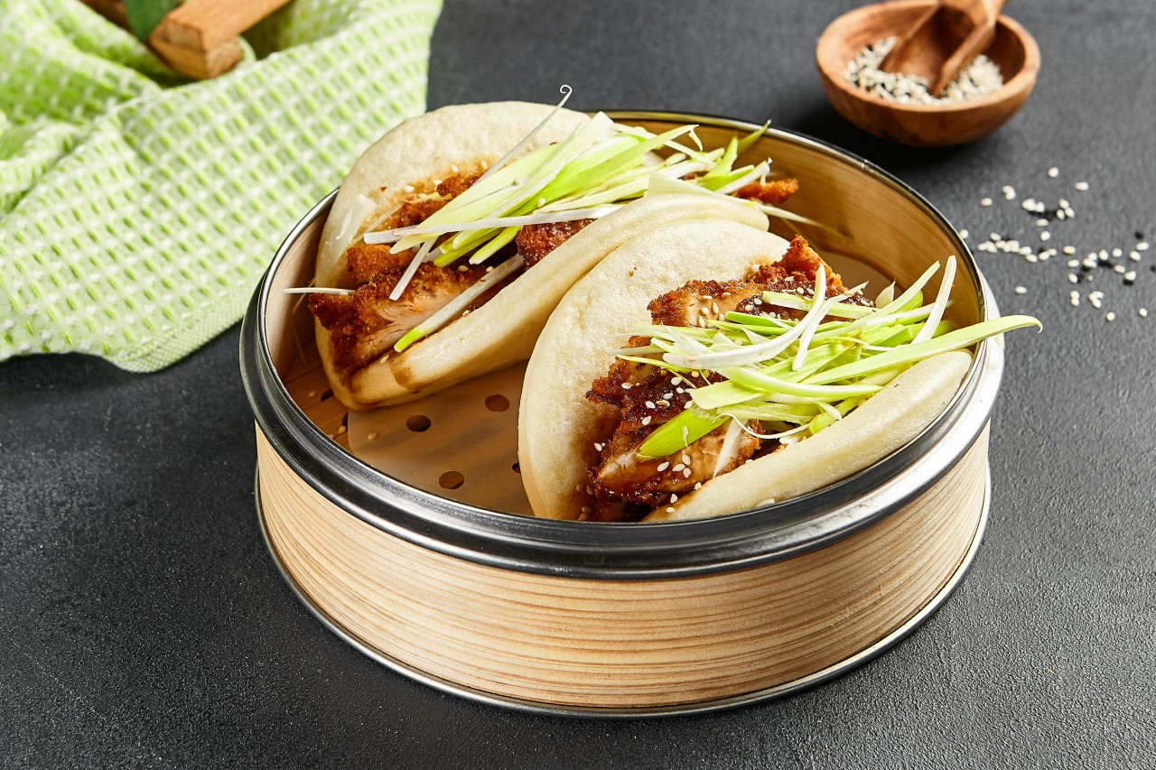 Baos are light and fluffy steamed buns filled with different meats and vegetables.