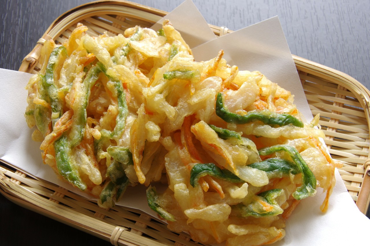 Tempura is a very thin and crunchy batter. The tempura batter is traditionally prepared with flour, egg and ice water.